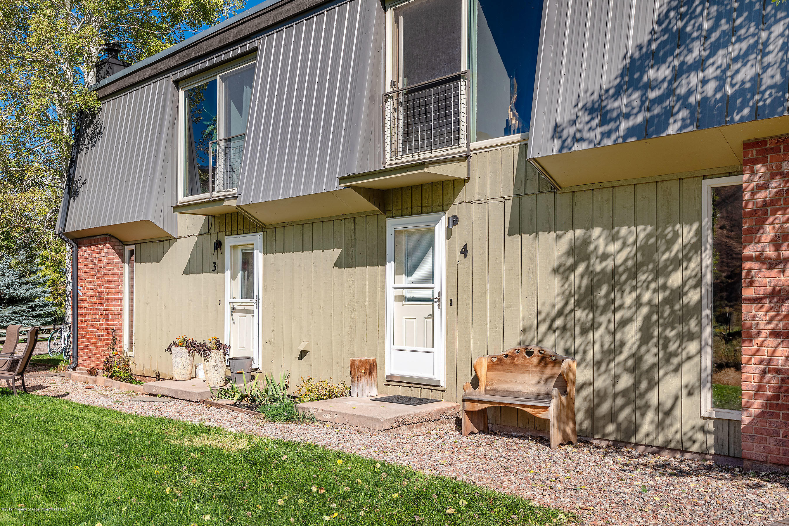 548 Holland Hills Road, Unit 4 Basalt, CO 81621 - Photo 18 of 20 a front view of a house with garden
