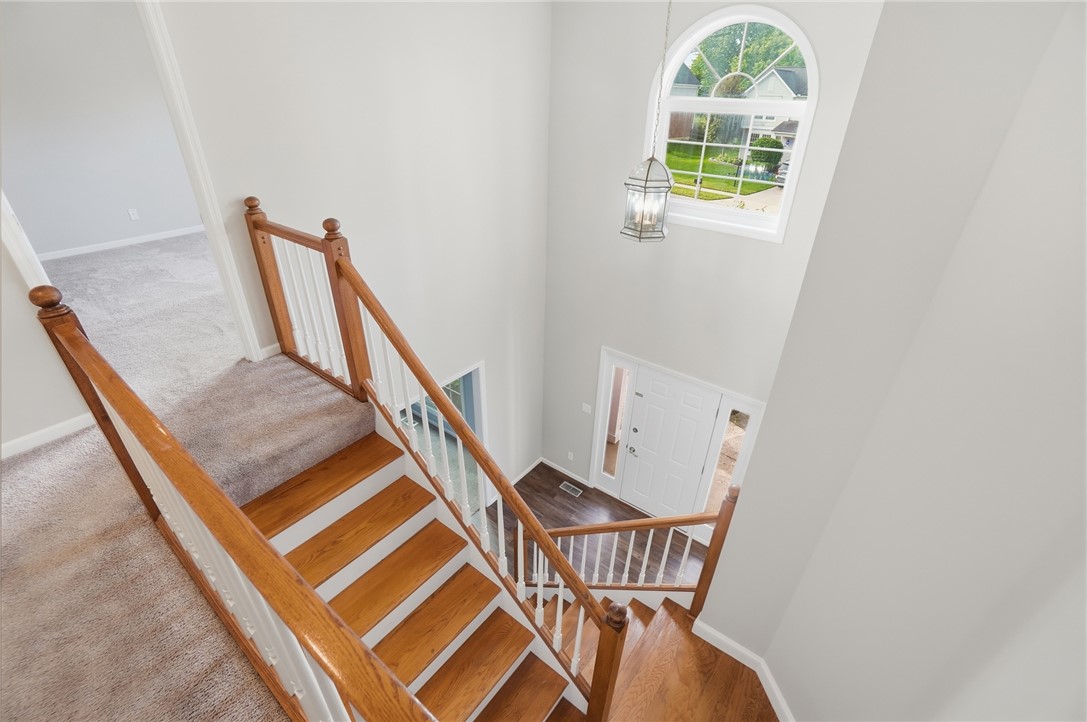 10 Chase Court Springboro, OH 45066 - Photo 31 of 75 This welcoming entryway showcases a grand staircase and abundant natural light.