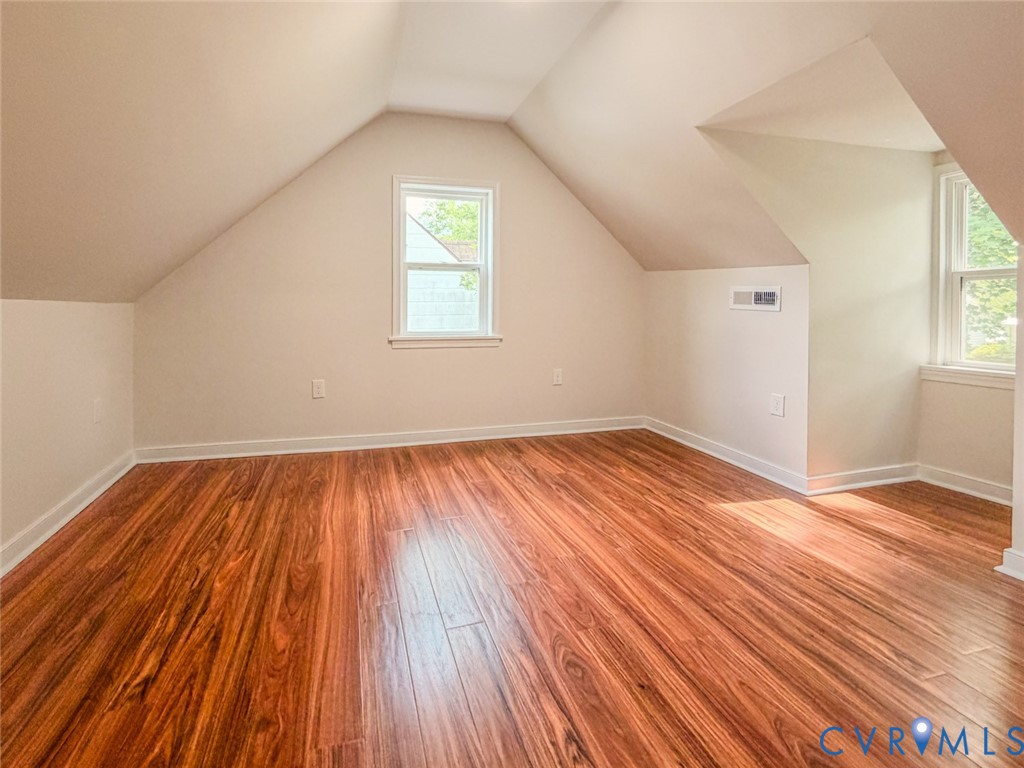 3409 Meadowbridge Road Richmond, VA 23222 - Photo 20 of 32 an empty room with wooden floor and windows