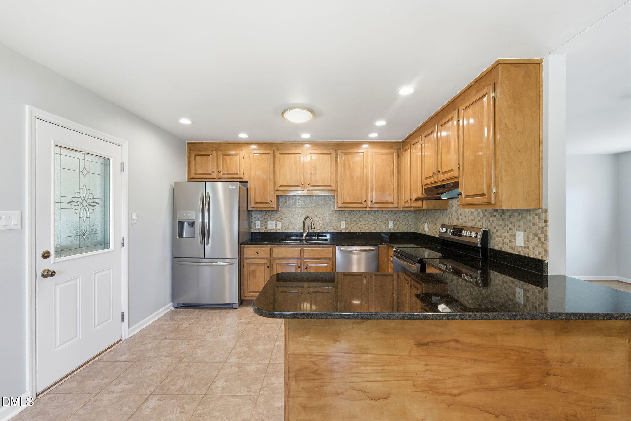 812 East Stagecoach Road Mebane, NC 27302 - Photo 9 of 25 a kitchen with a refrigerator and a sink