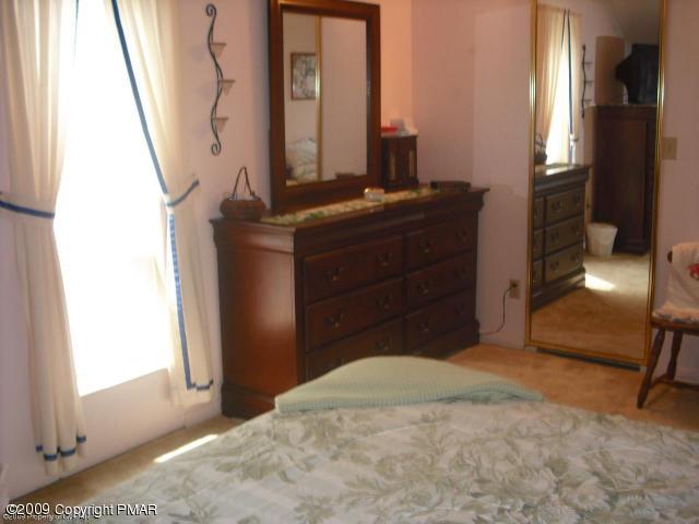 577 Sorbertown Hill Road Hunlock Creek, PA 18621 - Photo 7 of 22 a bedroom with a bed and a mirror