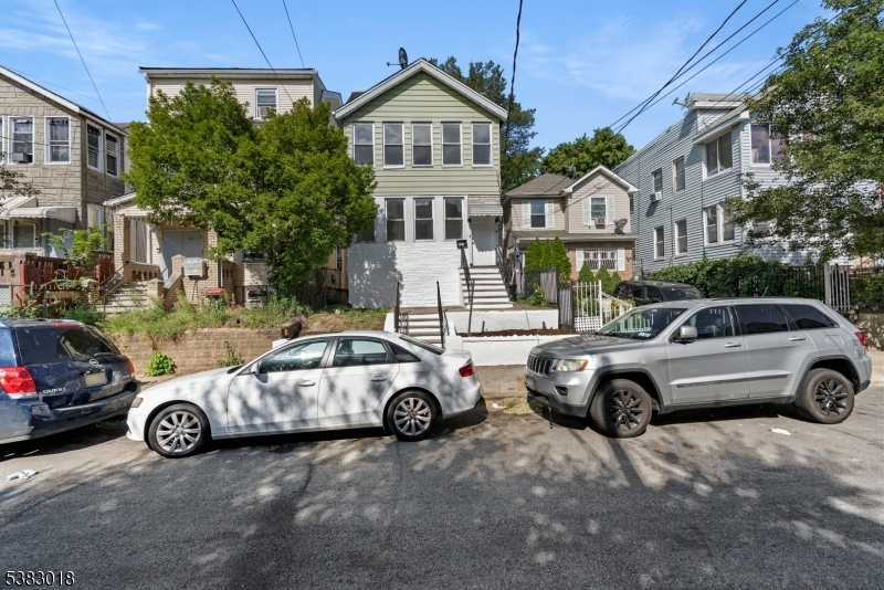 431 South 14th Street Newark, NJ 07103 - Photo 16 of 16 a car parked in front of a house