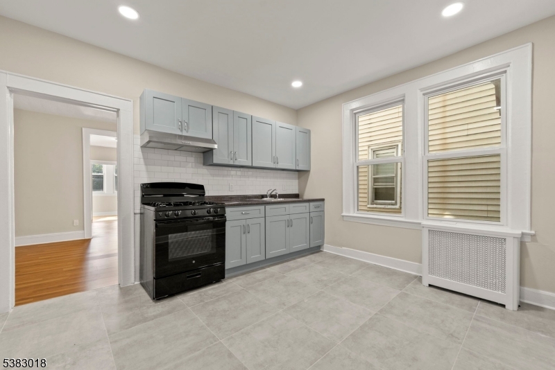 431 South 14th Street Newark, NJ 07103 - Photo 2 of 16 a kitchen with a stove and a window