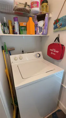 a kitchen with a sink refrigerator and dining table
