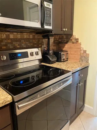 a close view of a stove top oven and counter space