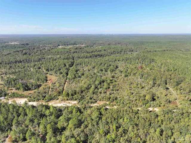 a view of a field with an outdoor space