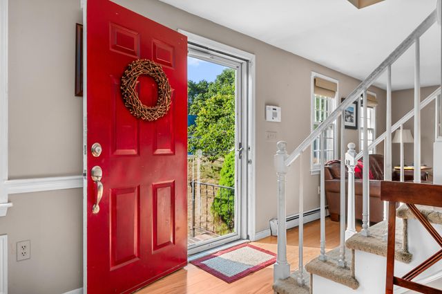a living room with furniture a fireplace and a table