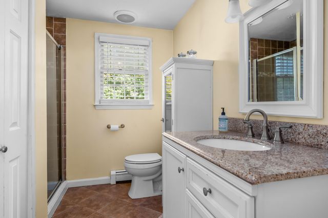 a spacious bedroom with a bed and a window