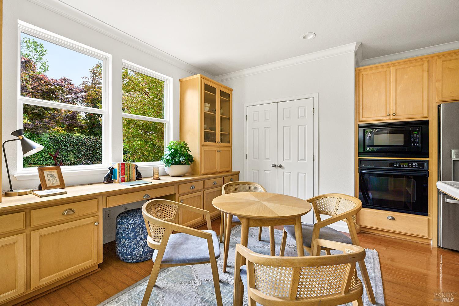 38 Maybeck Street Novato, CA 94949 - Photo 19 of 47 a kitchen with a stove a table and chairs in it