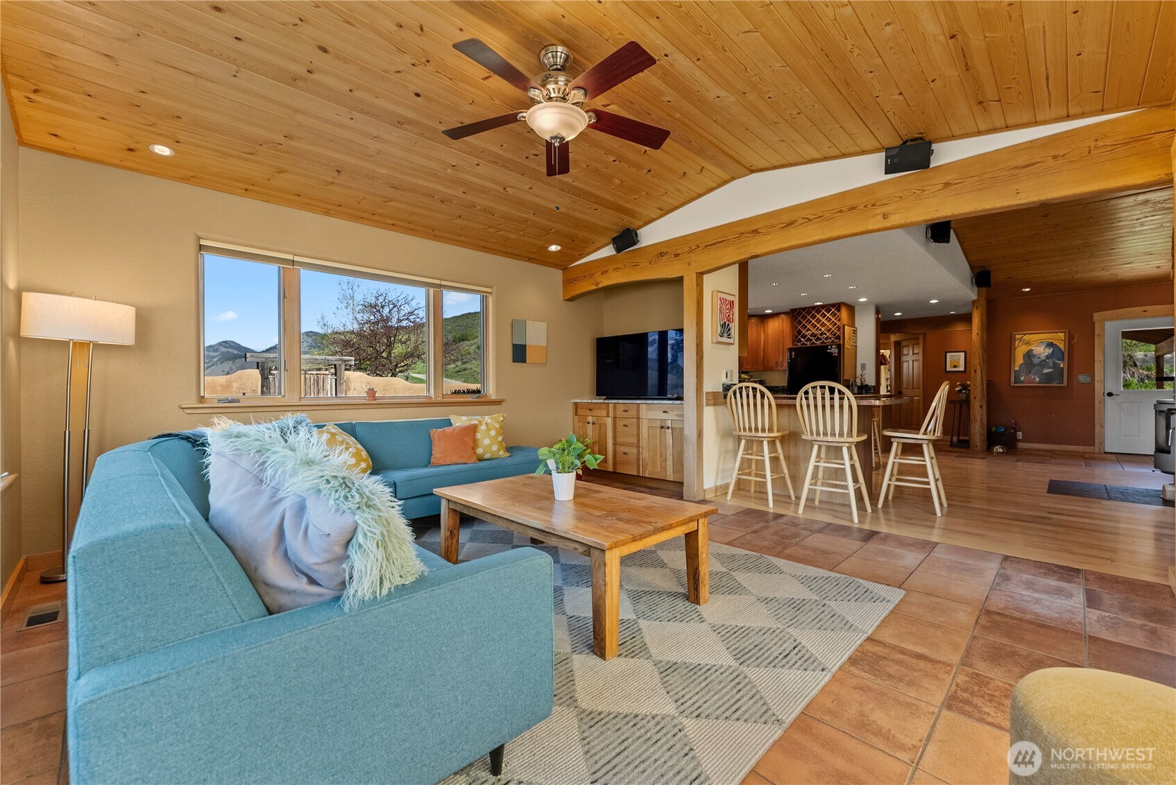 75 Rolling Rock Road Winthrop, WA 98862 - Photo 17 of 40 a living room with furniture a dining table and a rug