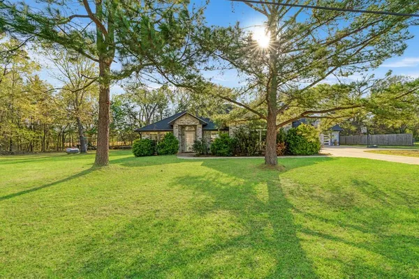 a house view with swimming pool in front of it