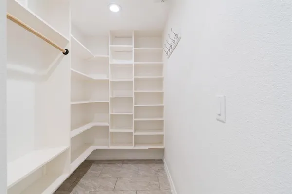 a view of an empty walk in closet