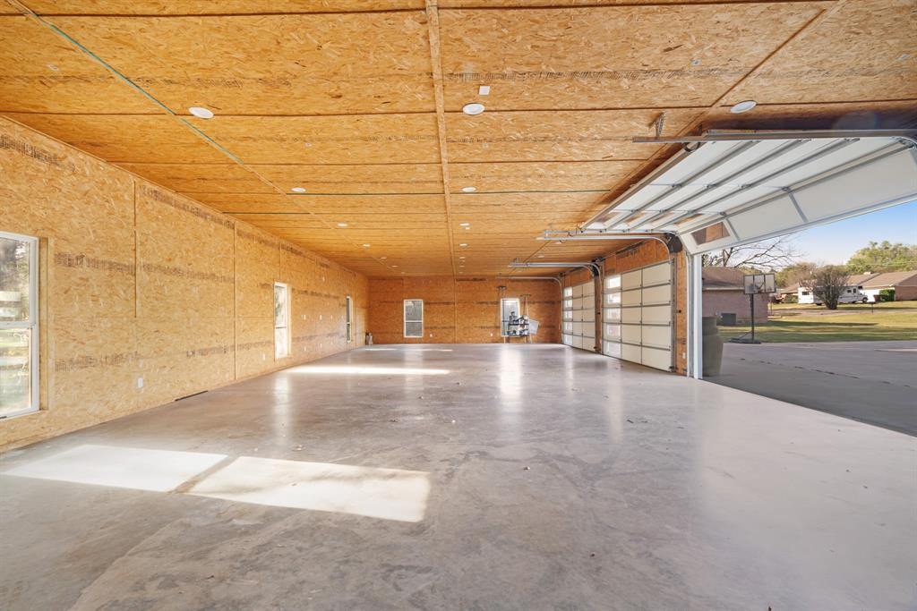 220 Laredo Drive Reno, TX 75462 - Photo 19 of 24 a view of a indoor garage