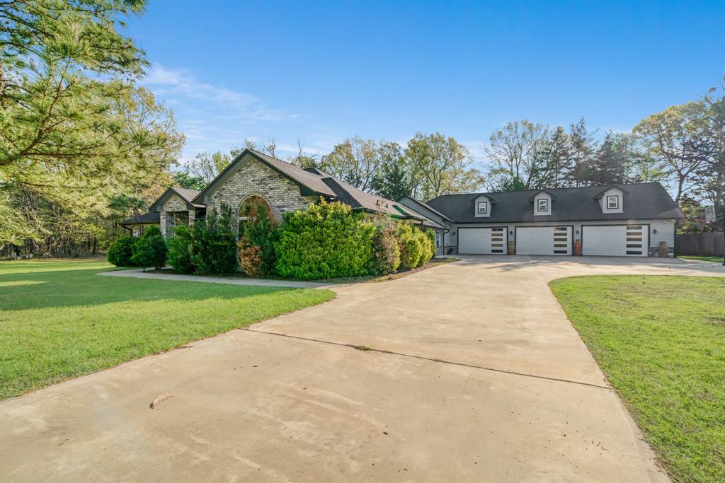 220 Laredo Drive Reno, TX 75462 - Photo 2 of 24 a house view with a outdoor space