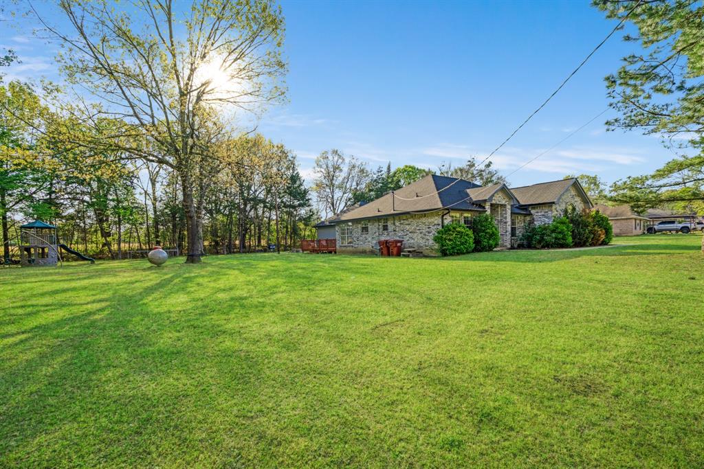 220 Laredo Drive Reno, TX 75462 - Photo 22 of 24 a front view of house with garden