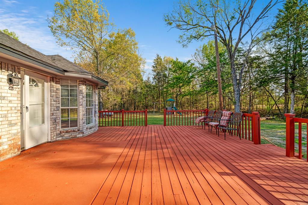 220 Laredo Drive Reno, TX 75462 - Photo 24 of 24 a view of a backyard with a large tree