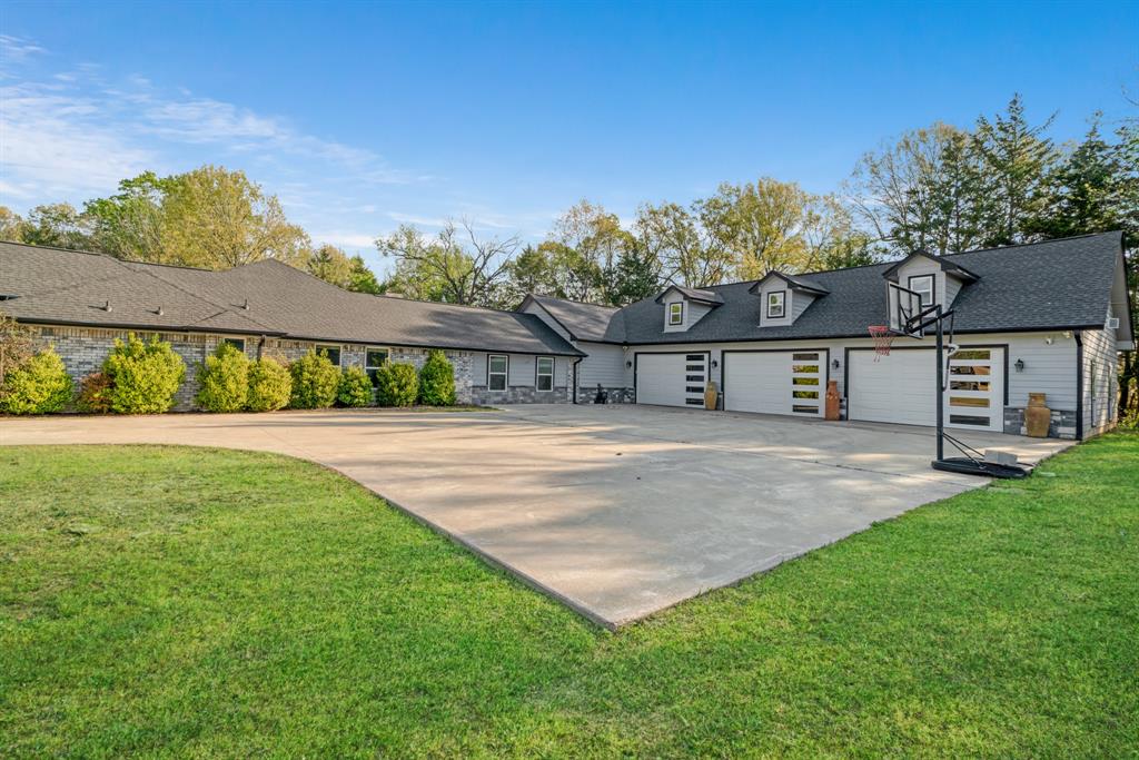 220 Laredo Drive Reno, TX 75462 - Photo 3 of 24 a view of house with yard