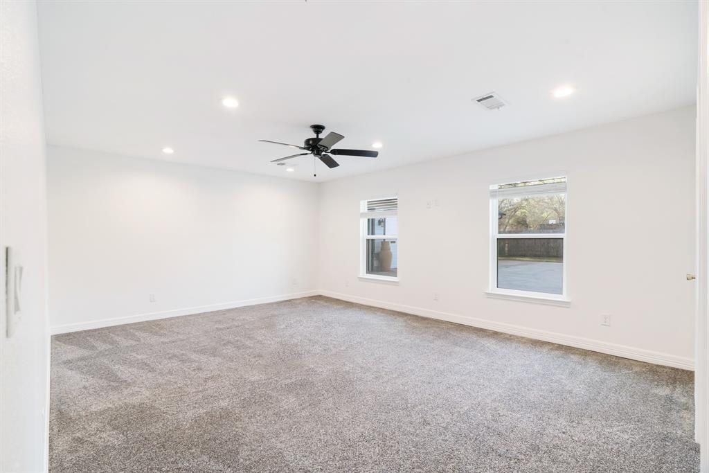 220 Laredo Drive Reno, TX 75462 - Photo 10 of 24 an empty room with windows and fan