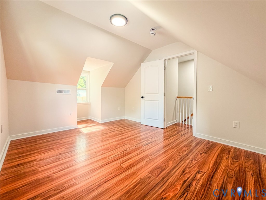 3409 Meadowbridge Road Richmond, VA 23222 - Photo 24 of 32 an empty room with wooden floor