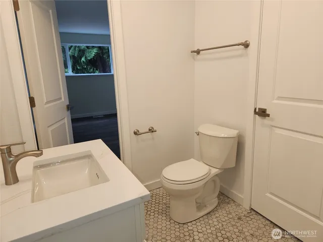 a view of a house with a yard and deck