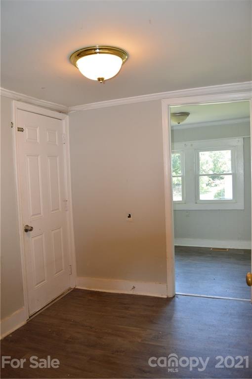 65 Alexander Road Stony Point, NC 28678 - Photo 11 of 19 an empty room with wooden floor and windows