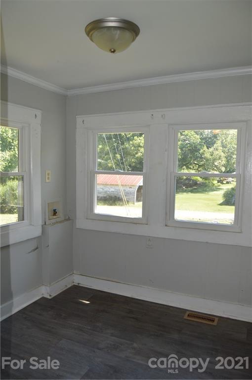 65 Alexander Road Stony Point, NC 28678 - Photo 13 of 19 an empty room with wooden floor and windows