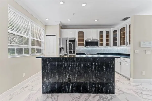 a kitchen with a sink and cabinets