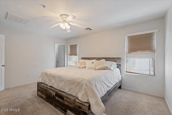 a bedroom with a bed and window