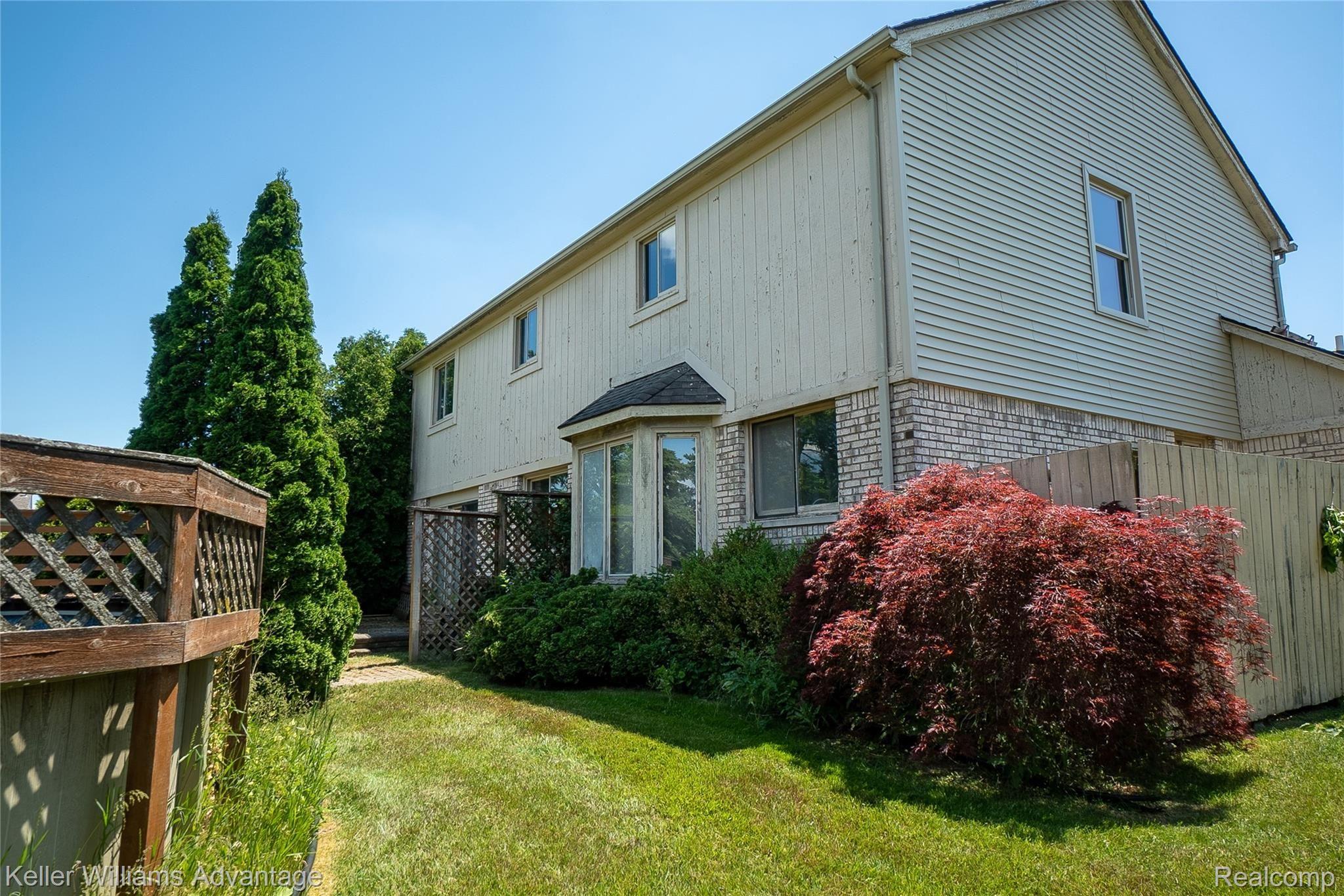 16349 Liberty Bell Road North Macomb, MI 48044 - Photo 2 of 33 LibertyBell_16349_backhouse a1.jpg