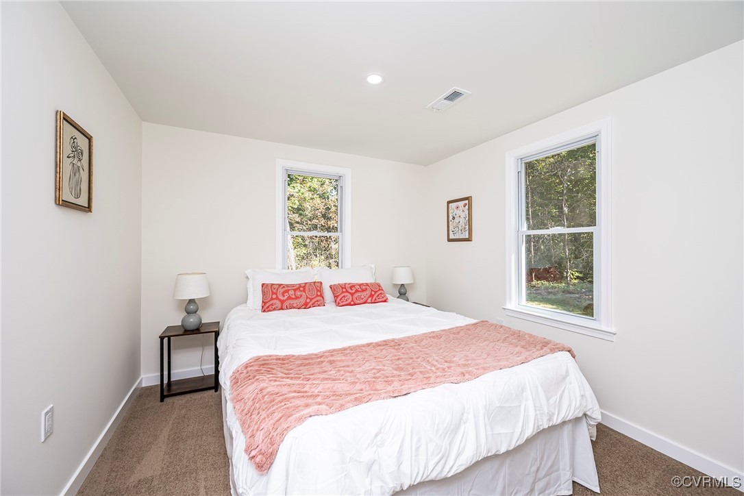 17314 Hewlett Road Beaverdam, VA 23015 - Photo 12 of 16 a bedroom with a bed and a window
