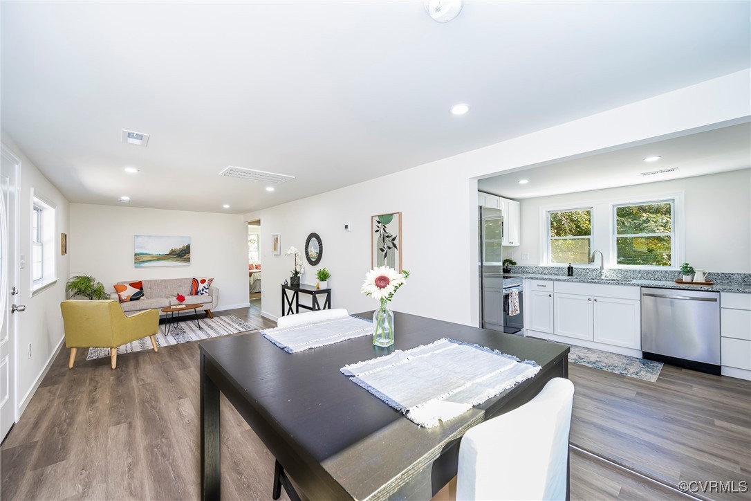 17314 Hewlett Road Beaverdam, VA 23015 - Photo 4 of 16 a view of a dining room with furniture and wooden floor