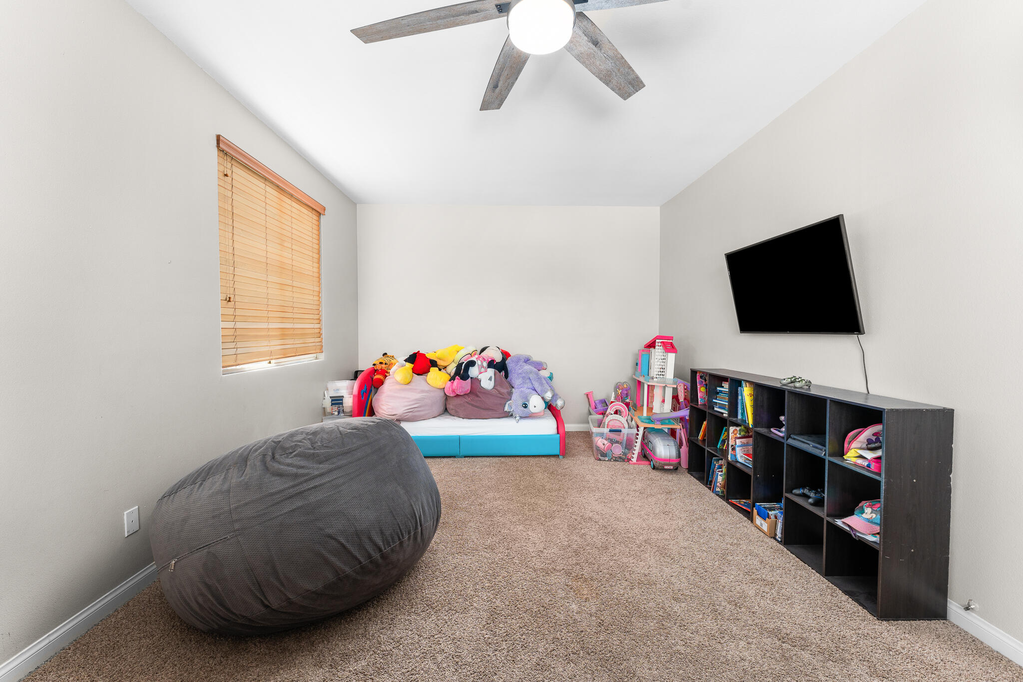 80722 Diamondback Trail Indio, CA 92201 - Photo 24 of 38 a room with toys and a flat screen tv