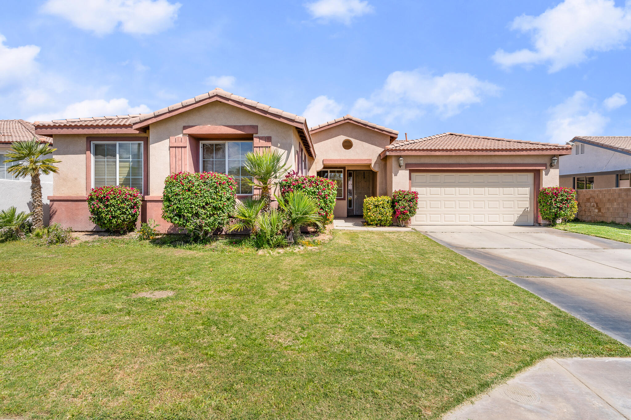 80722 Diamondback Trail Indio, CA 92201 - Photo 4 of 38 a front view of a house with garden