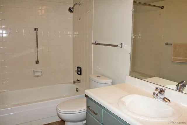 a bathroom with a sink a toilet and a bathtub