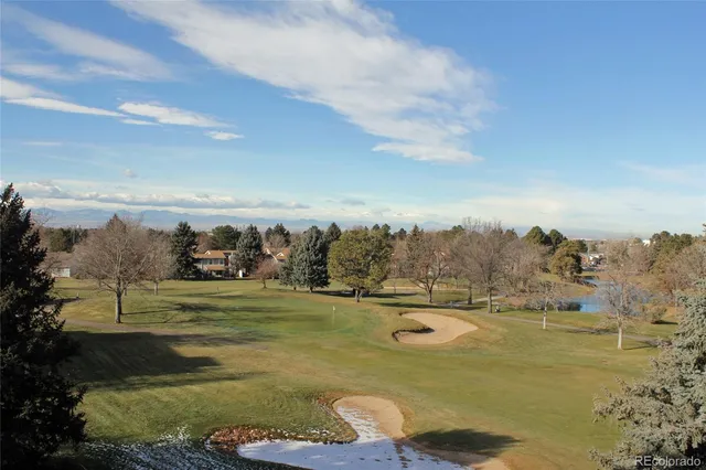 a view of a lake with a yard