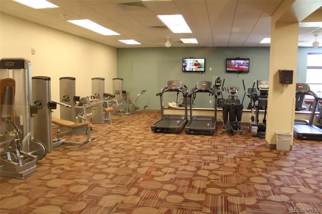 a patio with table and chairs