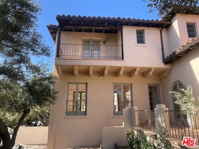 a bedroom with a bed and mirror