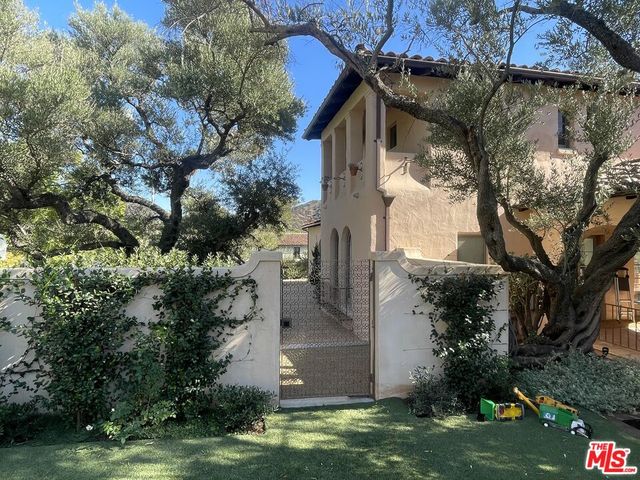 a spacious bedroom with a bed and a table in it