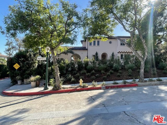 a lobby with furniture and a potted plant