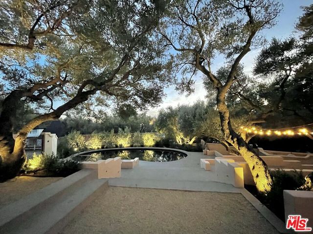 a view of city street with a car parked on the street side