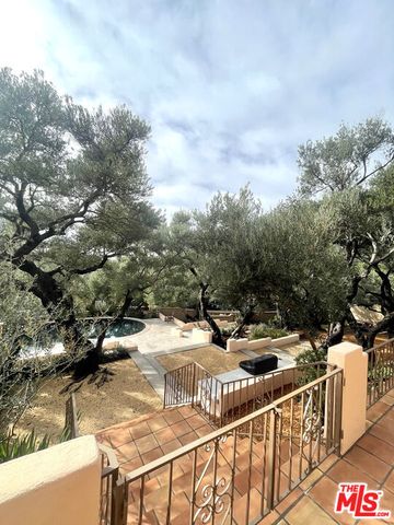 a bathroom with a window and a shower