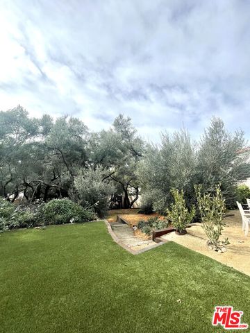 a large white bed in a white room