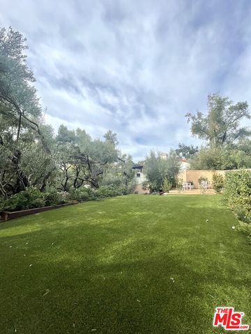 a view of a balcony with wooden floor