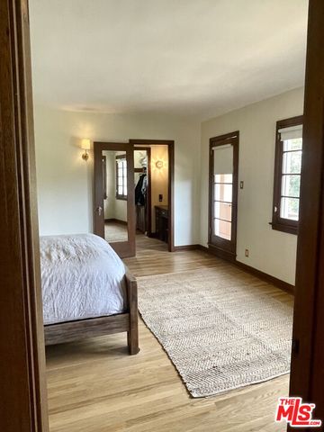 a bed room with a bed and a lamp