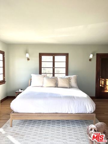 a bedroom with furniture and windows