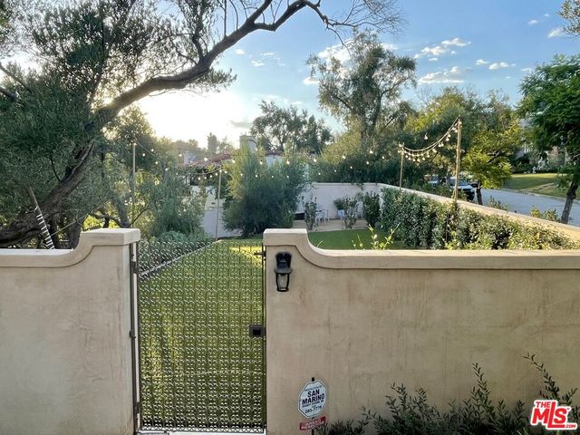 a view of city street with lots of swings and slides