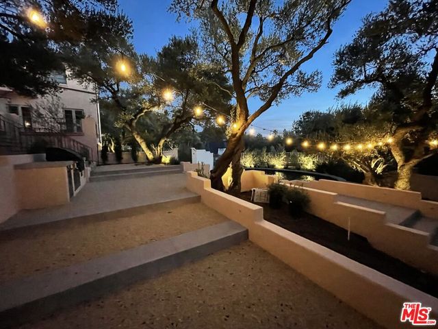 a view of a balcony with couch and trees