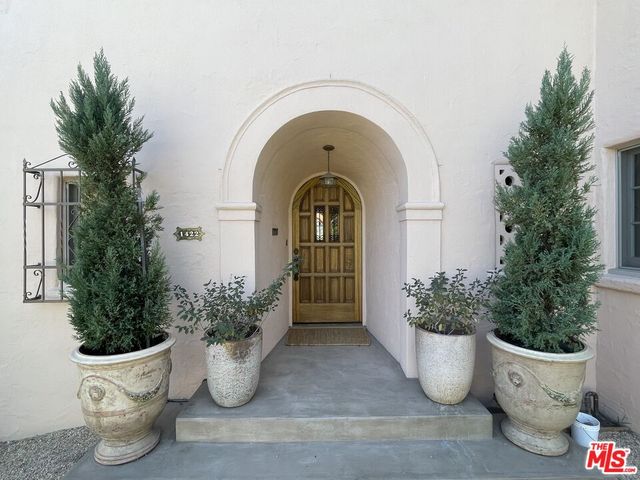 a front view of a house with lots of green space