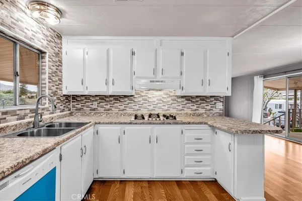 a kitchen with a sink and cabinets