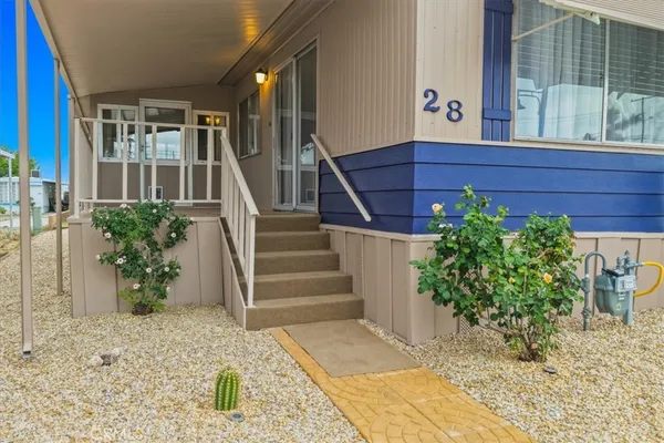 a view of front door and potted plants